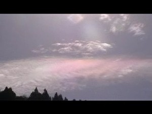 The colour is due to refractions of the metallic content of the aerosols
